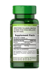 Puritan's Pride Spirulina 500 mg supplement facts label on green bottle, showing ingredients and dosage information.