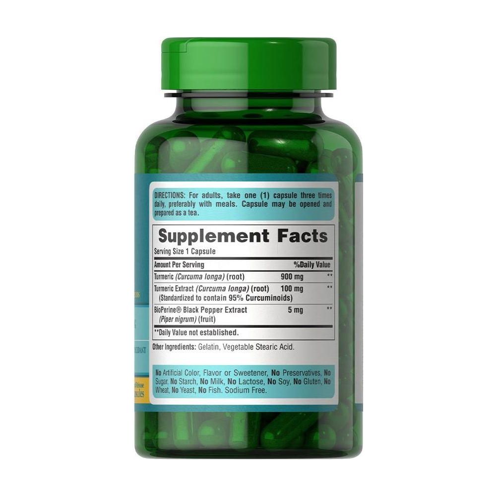 Puritan's Pride turmeric curcumin supplement bottle with dosing information and green capsules.