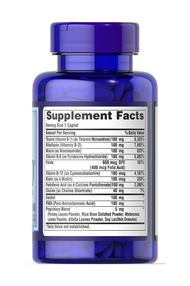 Puritan's Pride Vitamin B-100 Complex supplement facts label showing nutritional information and ingredients on a blue bottle.