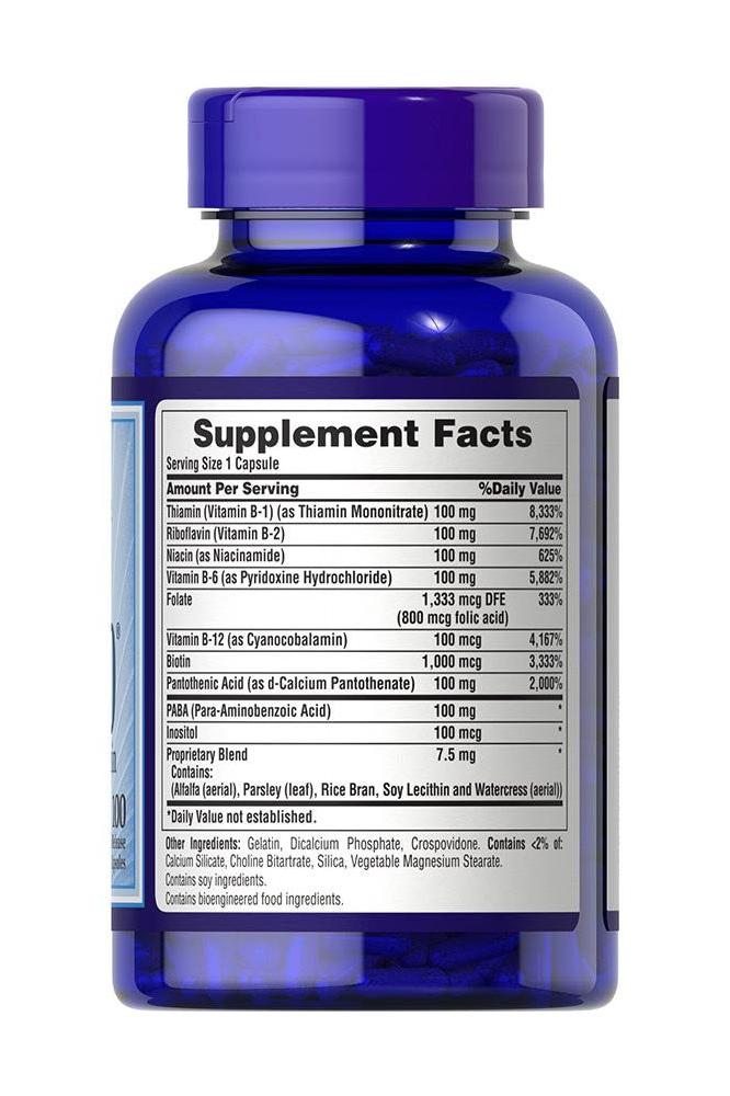 Puritan's Pride Vitamin B-100 Complex supplement facts label on blue bottle, showcasing B-vitamin content and benefits.