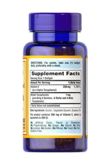 Puritan's Pride Vitamin E 400 iu supplement bottle with ingredient facts and serving details.