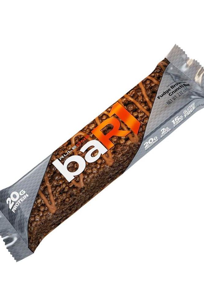 Rule One Bar1 Crunch Bar in fudge chocolate flavor, featuring 20g protein and crispy, creamy texture.
