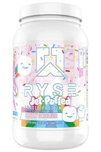 RYSE Loaded Protein in Birthday Cake flavor, featuring a colorful design with sprinkles and marshmallow graphics.