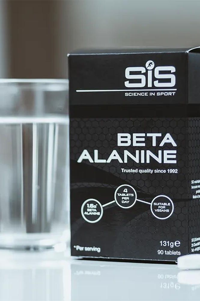 Science in Sport Beta Alanine 90 tablets box with a glass of water, ideal for enhancing athletic performance.