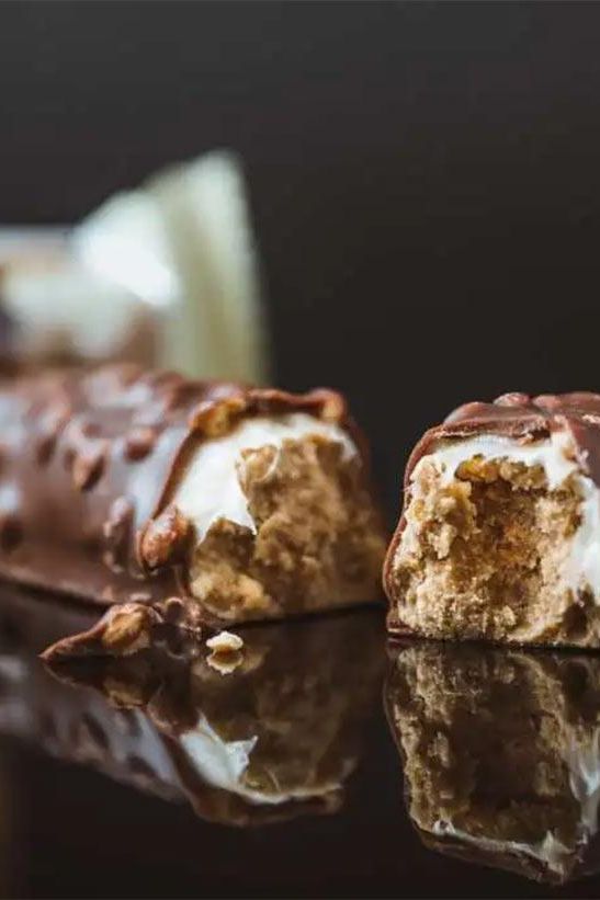 Close-up of Science in Sport Protein20 Bar, showing a delicious chocolate coating and a soft, chewy center.