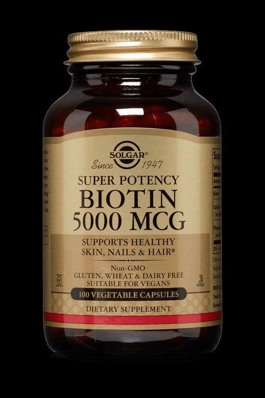 Solgar Super Potency Biotin 5000 MCG supplement bottle for healthy skin, nails, and hair, 100 vegetable capsules.