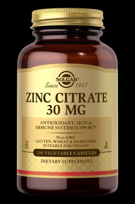 Solgar Zinc Citrate 30 mg dietary supplement in a brown jar with 100 vegetable capsules for immune system support.