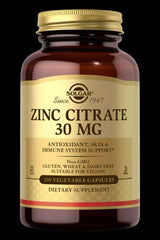 Solgar Zinc Citrate 30 mg dietary supplement in a brown jar with 100 vegetable capsules for immune system support.