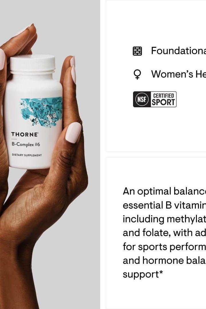 Thorne B-Complex #6 dietary supplement in a woman's hand, promoting energy and hormone balance support.