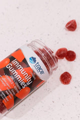 Trace Minerals Immunity Gummies bottle with red gummies on a countertop, supporting a healthy immune system.