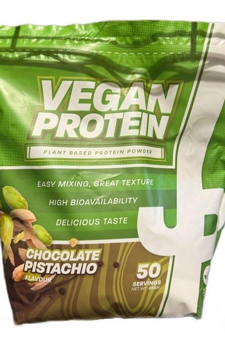 Trained by JP Vegan Protein chocolate pistachio flavor, plant-based protein powder, 50 servings, easy mixing and great texture.