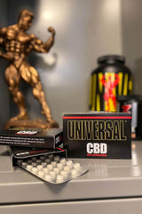 Universal Nutrition CBD Melting Tablets with Ashwagandha, 30 tablets, displayed alongside fitness products.