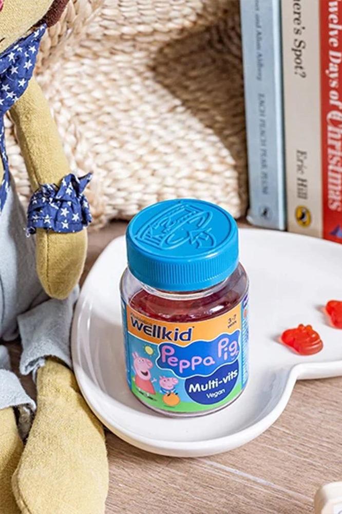 Wellkid Peppa Pig Multi-vitamins gummies on a plate, perfect for kids aged 3-7, featuring a delightful strawberry flavor.