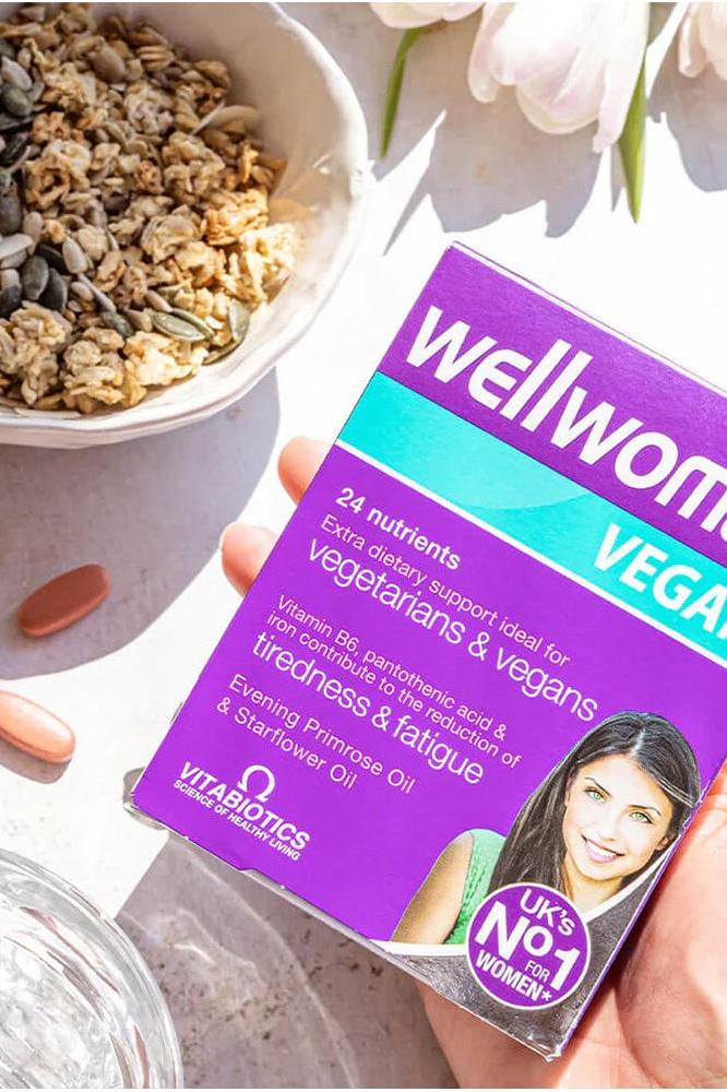 Vitabiotics Wellwoman Vegan supplement box highlighting 24 nutrients for vegetarians and vegans, ideal for women's health.